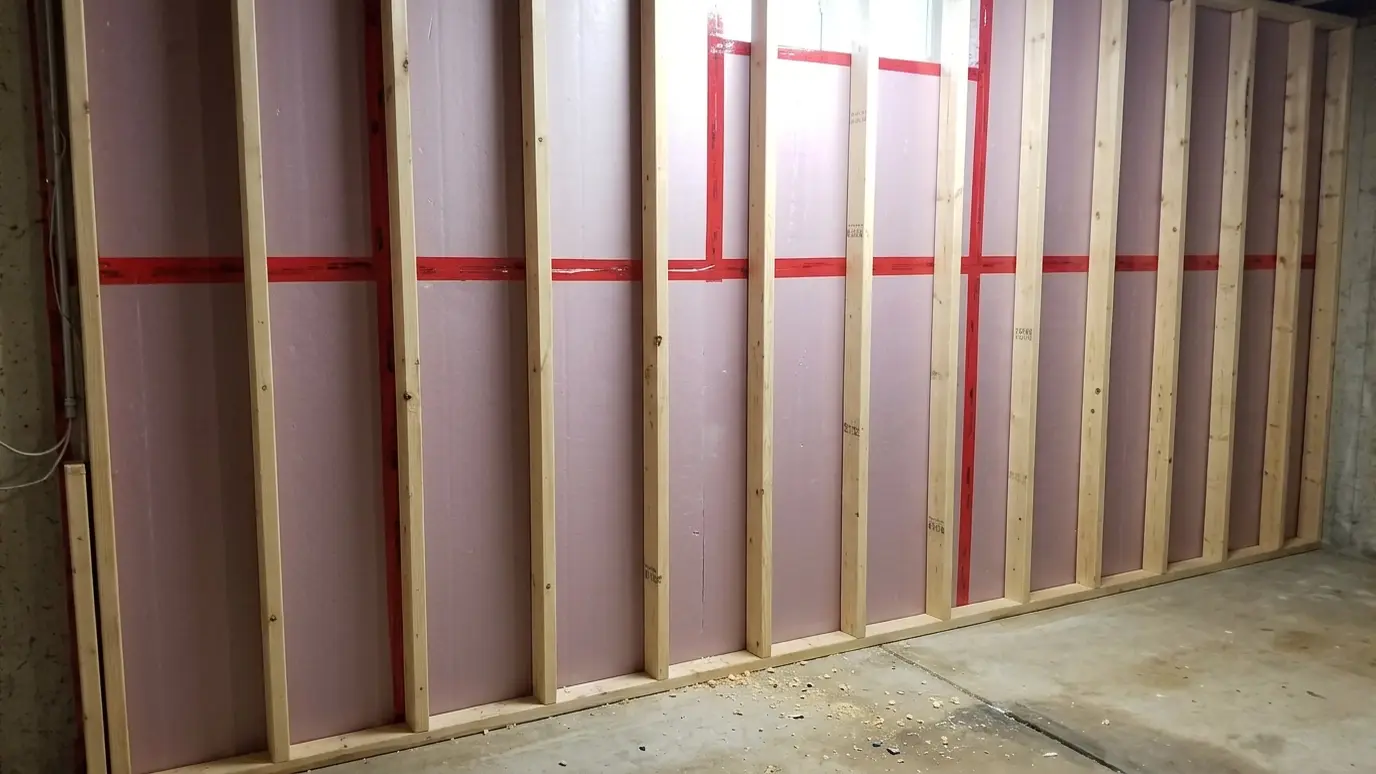After: Cold basement wall gets rigid foam | Music City Insulation After: a basement wall with a framed wall with rigid foam insulation against the concrete
