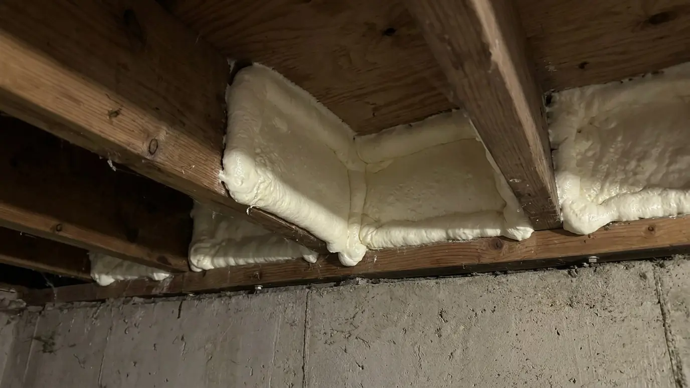 After: Drafty rim joist sealed with foam | Music City Insulation After: a basement rim joist with a rim joist sealed and insulated with spray foam
