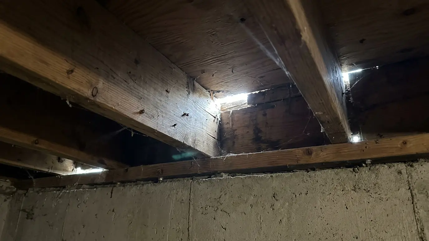 Before: a basement rim joist with an uninsulated, leaky rim joist